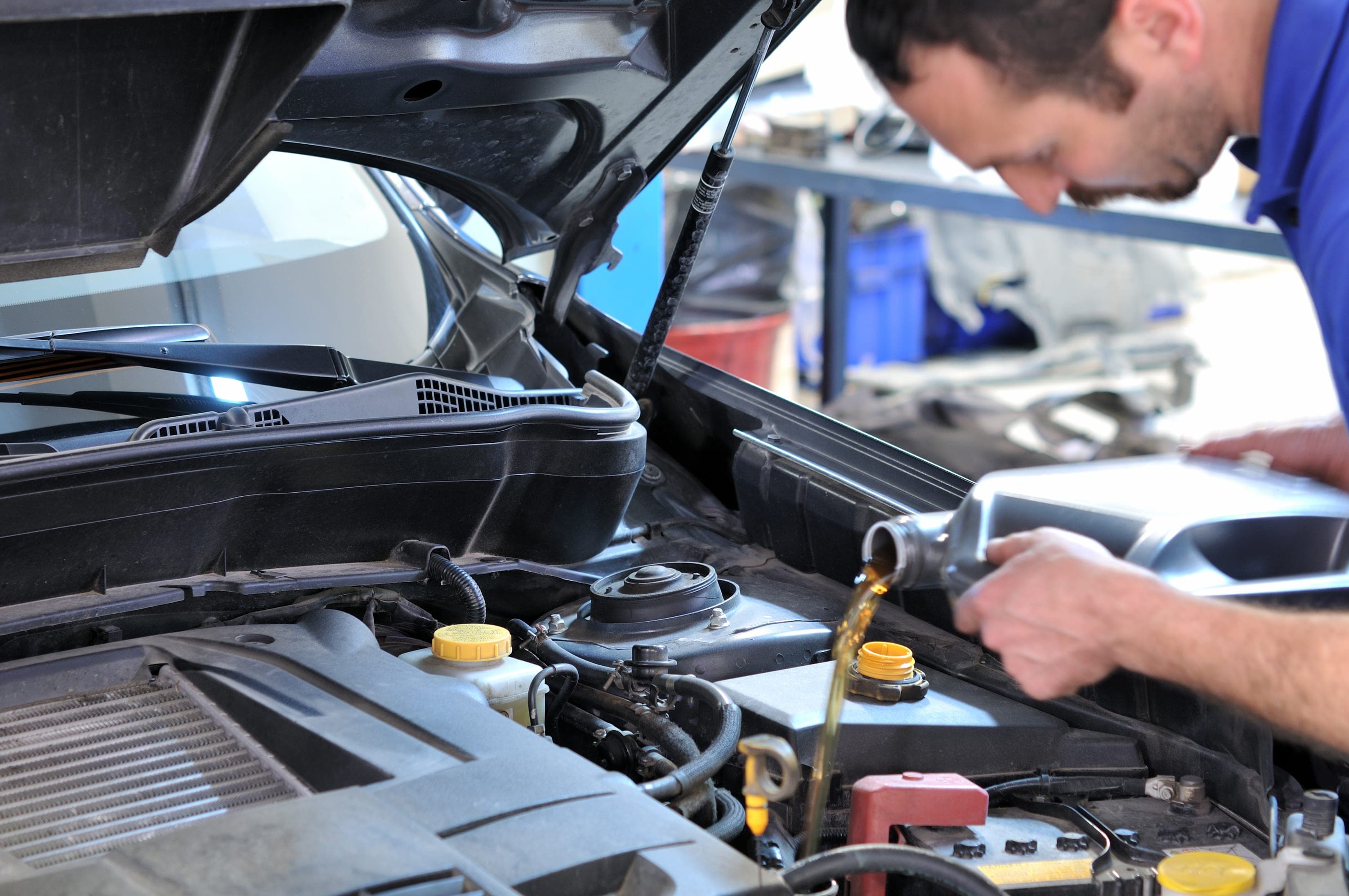 Technician performing battery and brake inspection service