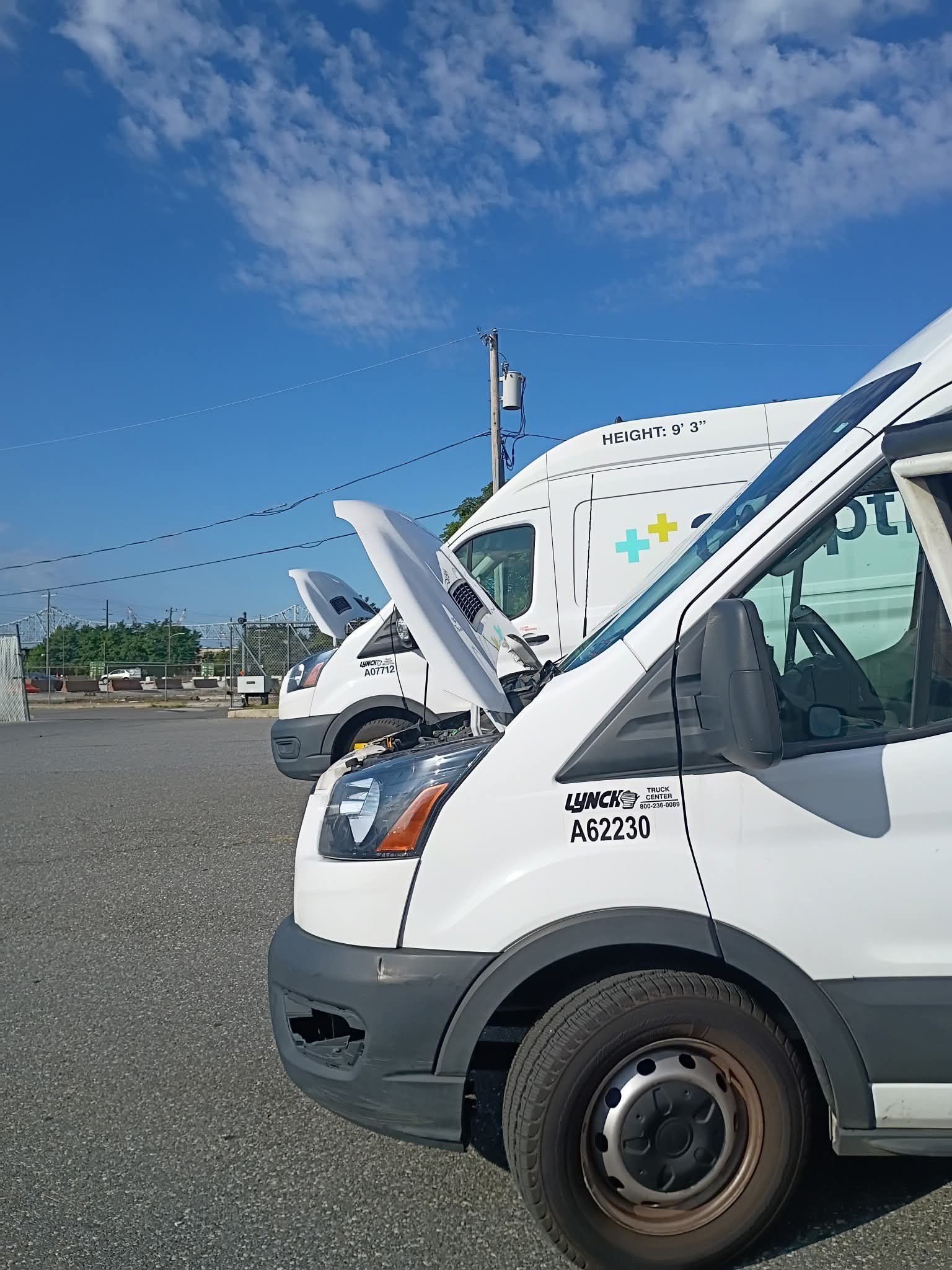 Fleet vans lined up for service at a customer lot.